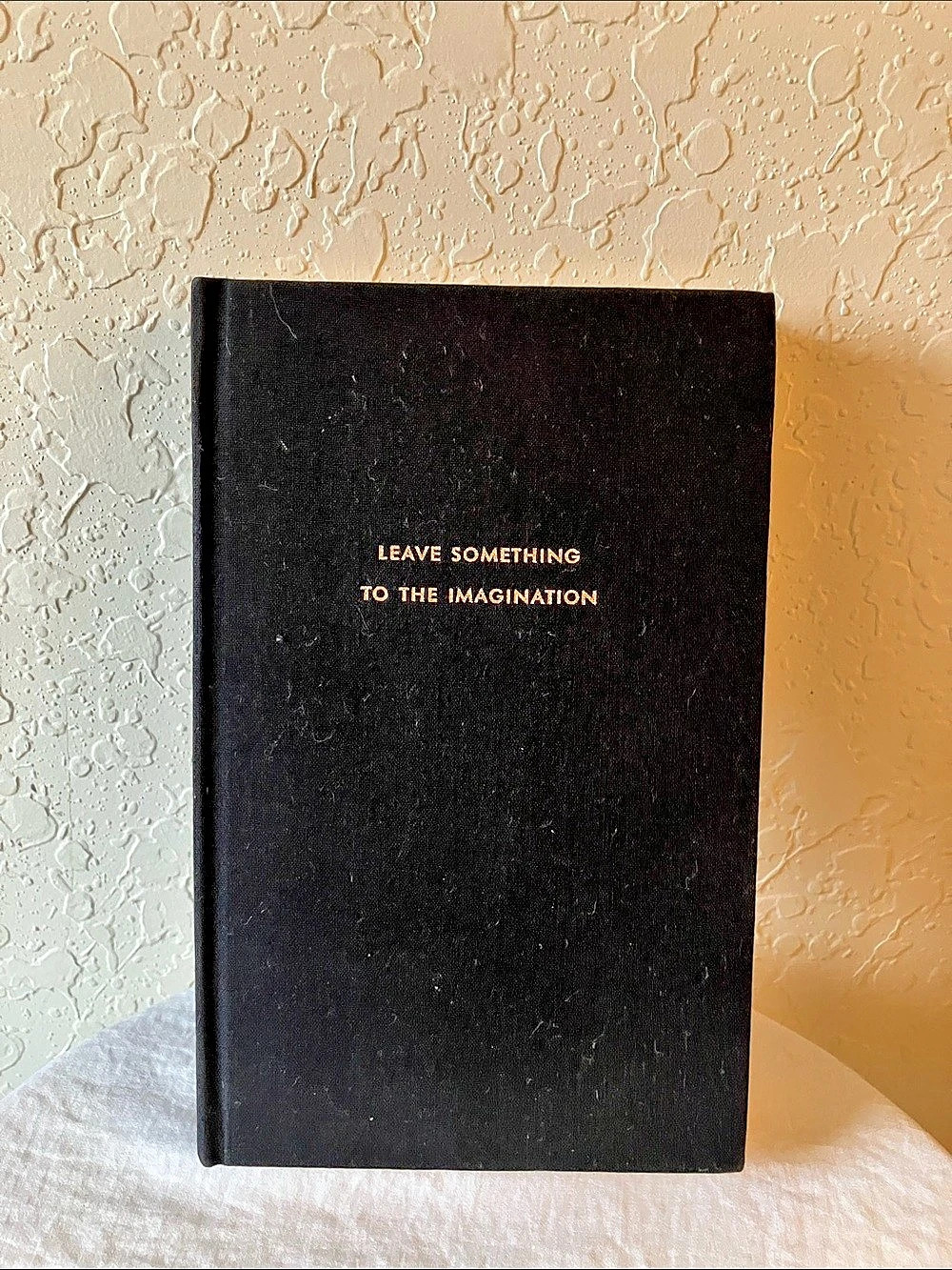 kate spade: “Leave Something to the Imagination” Journal- Black & Gold Foil